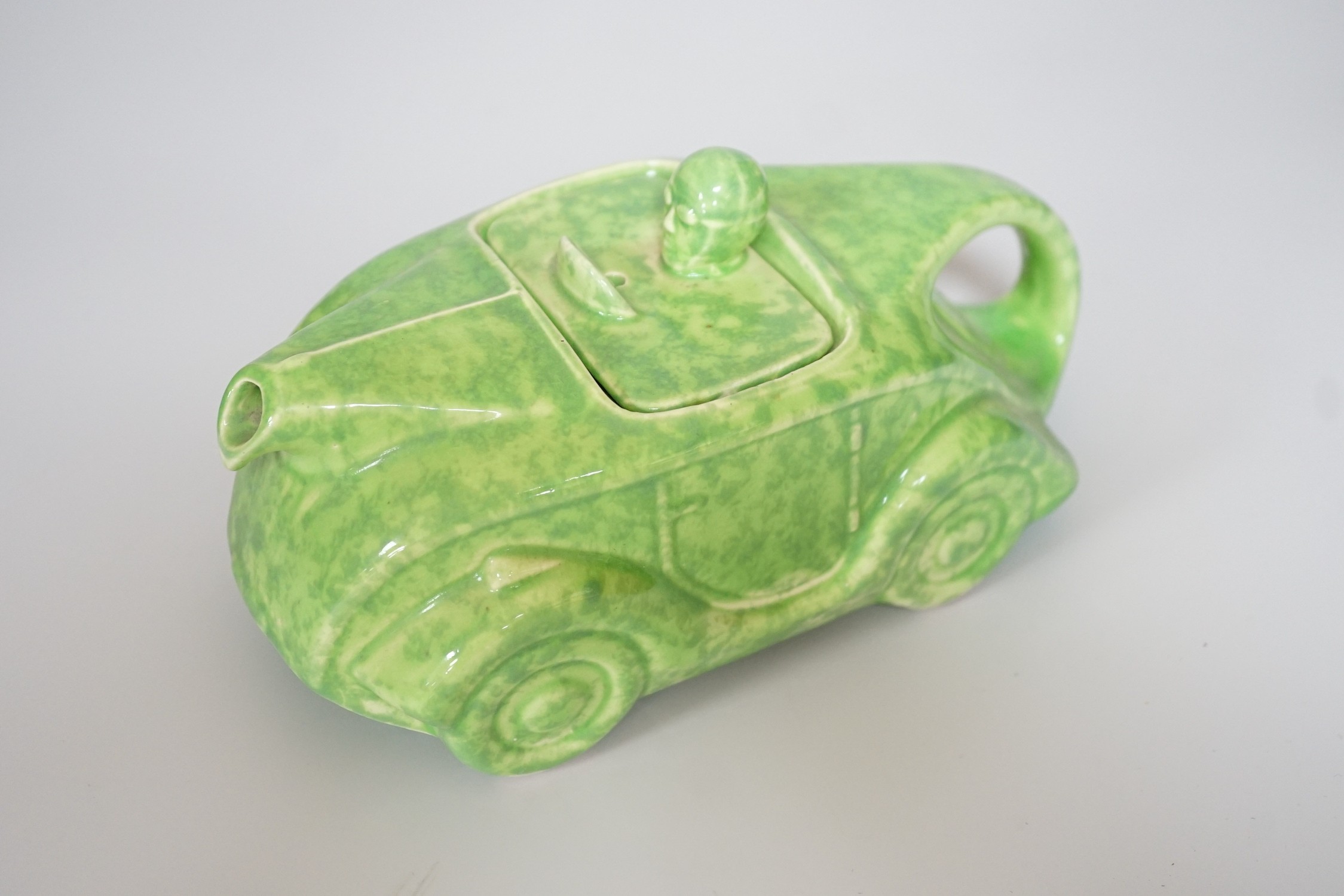 A Sadler's green-glazed novelty racing car teapot, 22cm
